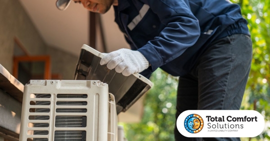 Photo of technician checking the HVAC