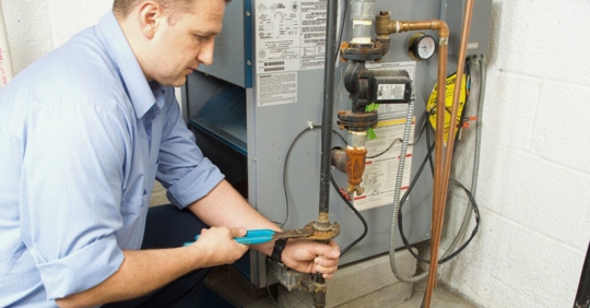 HVAC technician servicing a furnace