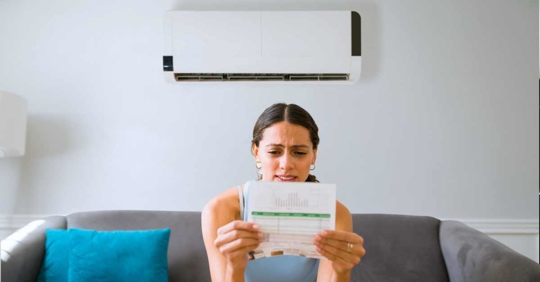 woman frustrated with her high electricity bill